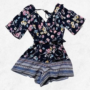 Francesca’s Blue Rain Romper Dark Blur w/ Colorful Flowers Size‎ XXS Zip V Neck